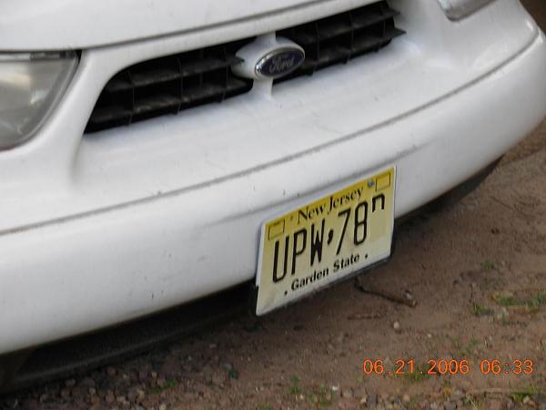 Pics from the body shop (after the side swipe) and the culprits van-lisenceplate.jpg