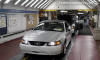 These 2004 Ford Mustangs approach the end of the assembly line at the historic Dearborn Assembly Plant