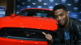 Rapper Kid Cudi Gets Close to New Mustang