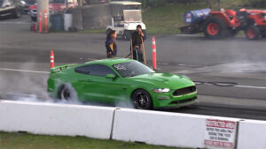 Modified S550 Mustang GT in Green at Drag Strip Doing Burnout