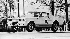 1965 Ford Mustang Shelby GT350 R Flying Through The Air During Race