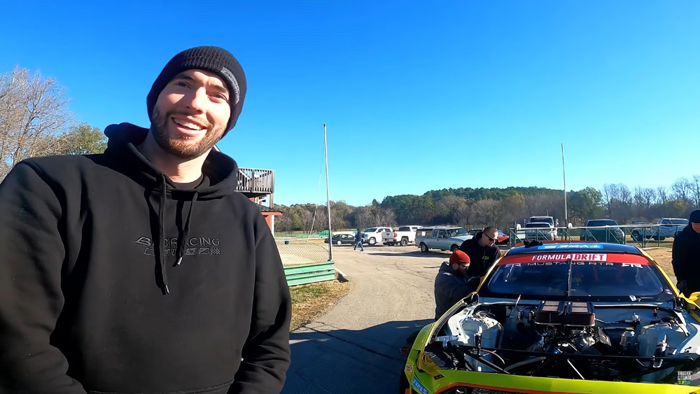James Deane standing in front of RTR Drift Mustang